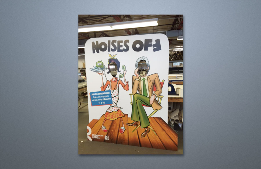 benchmark-roundabout-noises-off1 Lobby Display: Standee created for theatre-goers to use to have their pictures taken through the cut outs in the display. We imaged the 83” x 72” as two separate pieces up to 3’ x 8’ on ½” Ultra Board and held together with heavy duty construction tape.