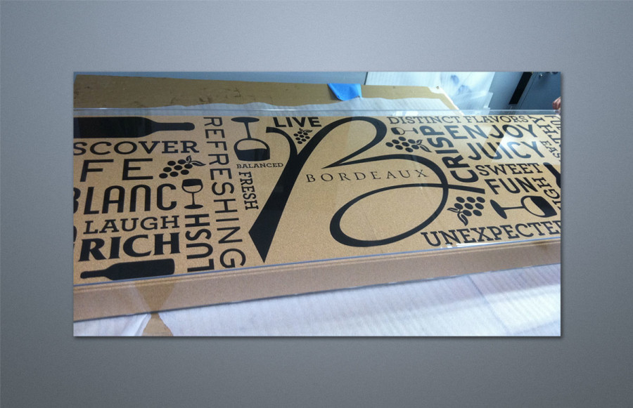 Bordeaux Display Case: 30" x 96" x 6" Custom laser etched to client's pattern on ¼" cork mounted to 4 ½" foam fill. Sides of foam also covered in cork. Entire display encased in ¼" plexiglass and packed for cross country shipping. Photos show unit prior to packing. Also shown is three color custom fabricated table skirt measuring 30" x 96" x 30" made out of black poly poplin "linen." The unit was used as a service bar at a trade show.